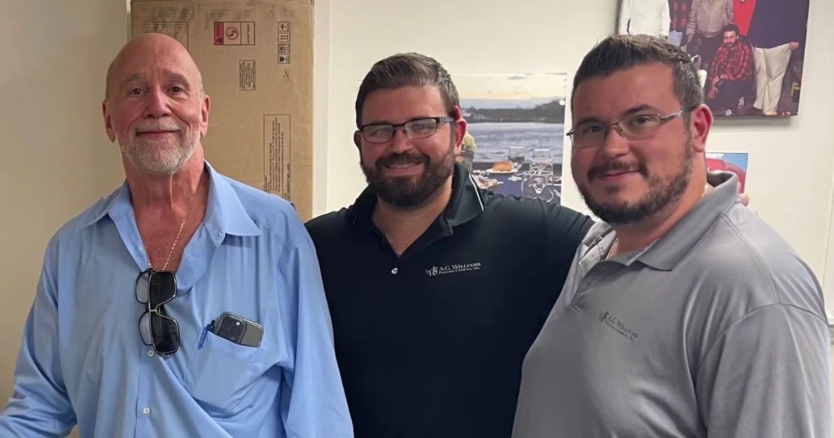 George P. Williams with his sons George A. Williams Jr. and Nicholas Williams at the A.G. Williams office.