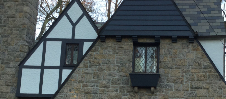 we repainted the wood on the exterior of this tudor-style home