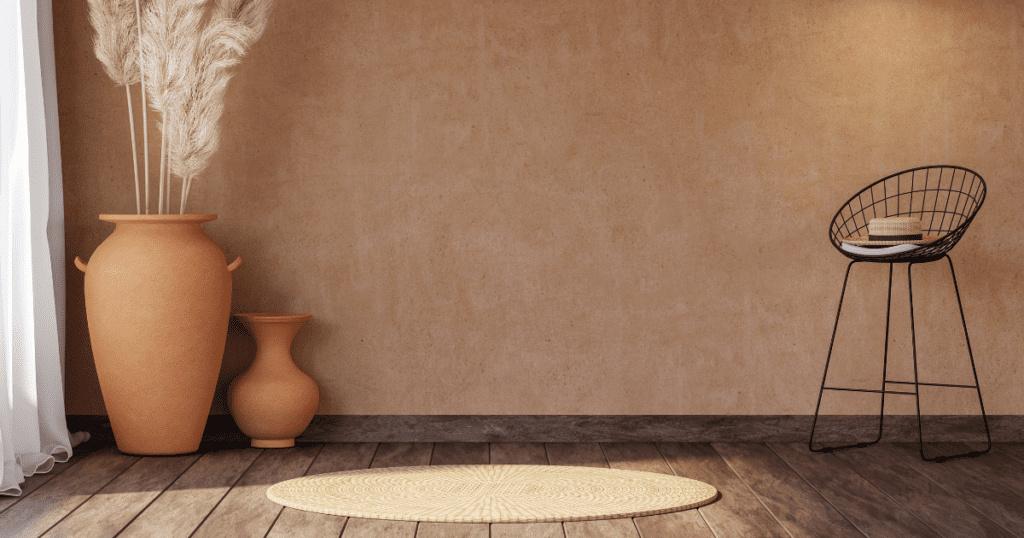 Minimalist interior decor with large orange vases and natural light.